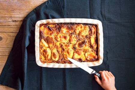 Baked Greek moussaka on the table. Top view.の写真素材