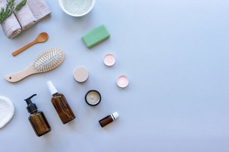 Top view hygiene items and natural cosmetics on light gray background. Beauty, spa and wellness concept. Flat lay, copy space.の写真素材