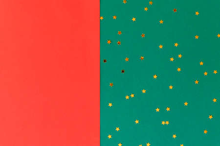 Red and green with confetti festive background. Christmas concept. Flat lay, copy space.の写真素材