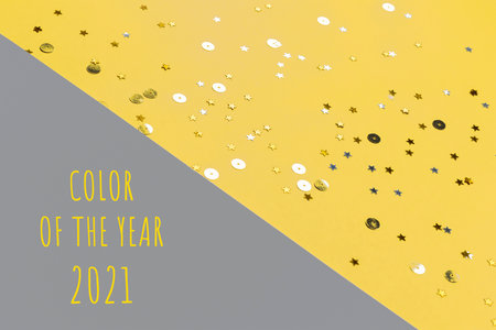 Gray and yellow festive background with confetti. Color of the year 2021.の写真素材