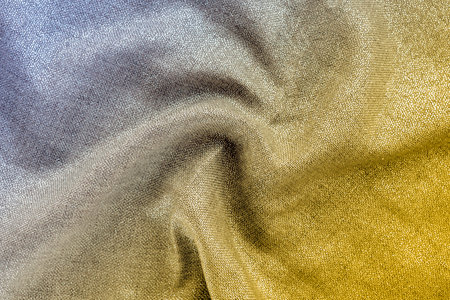 Shiny fabric with curl drape. Yellow and gray gradient, texture, background. Trendy colors 2021の写真素材