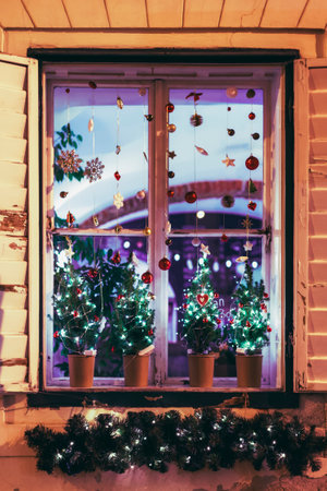 Window decorated for Christmas, view from outside. Winter holidays conceptの写真素材