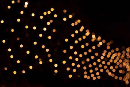 Festive bokeh lights on black background. Christmas conceptの写真素材