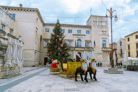 Peoples square in Zadar decorated for Christmas with walking people. Croatia.の写真素材