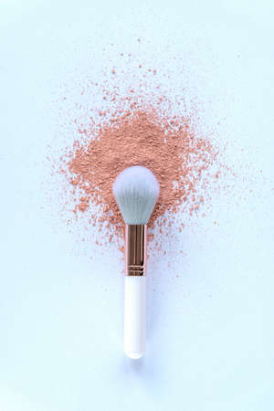 Make up brush with sprinkled powder on white background. Top view, flat lay.の写真素材