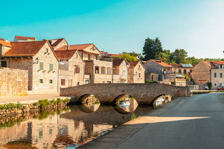 Bridge over channel in Vrboska, north coast of the island of Hvar in Dalmatia, Croatia.の写真素材