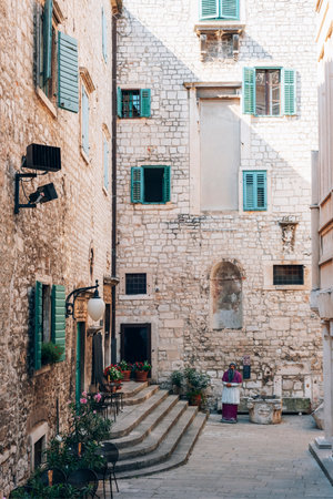 Old stone historic buildings of Sibenik, Croatia. Traditional Dalmatian old town architecture. Summer travel vacation concept.の写真素材