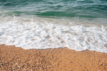 Sea waves, foam on the beach, top viewの写真素材