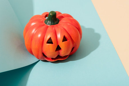 Jack-O-Lantern on blue and beige background. Halloween concept.の写真素材