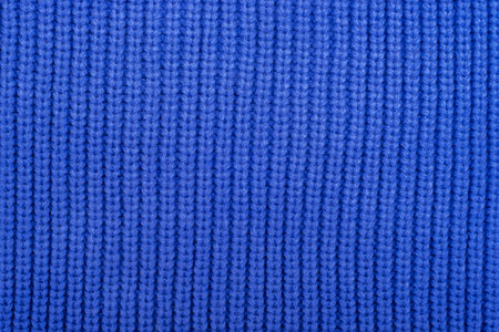 Blue knitted fabric background, texture. Abstract patternの写真素材