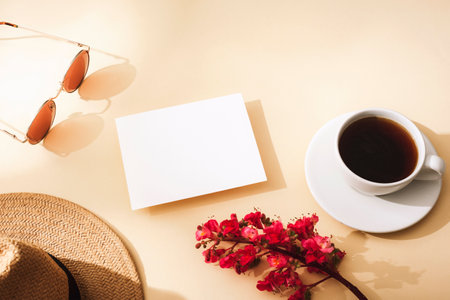 Blank card, coffee cup, straw hat, sunglasses and flower. Top view, flat lay Mockupの写真素材