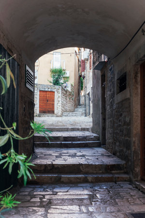 Arch and narrow street in old town of Sibenik, Croatia. Summer vacation travel background.の写真素材