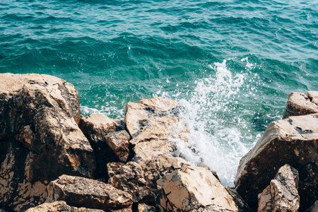 Sea wave breaking on the rocky coast. Natural background.の写真素材