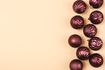 Christmas purple glitter bauble balls on neutral background with copy space. Top view, flat layの写真素材