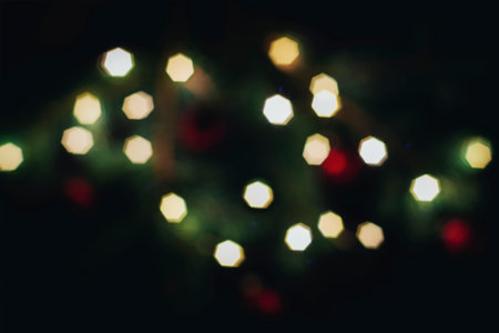 Festive glittering golden lights for your design. Golden bokeh lights on a dark background. Magical light, overlay or lens flare.の写真素材