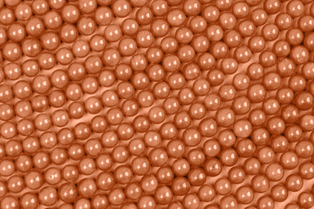 Necklaces and bracelets made from coral. Background, texture. Demonstrating color of the year 2024 Peach Fuzz.の写真素材