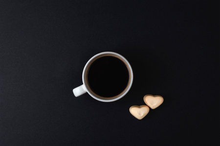 Coffee cup and heart shaped candies. Valentines day concept. Top view, flat lay.の写真素材