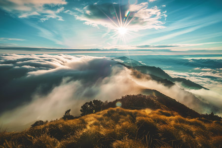 Top of the mountain with white clouds, sunny day.