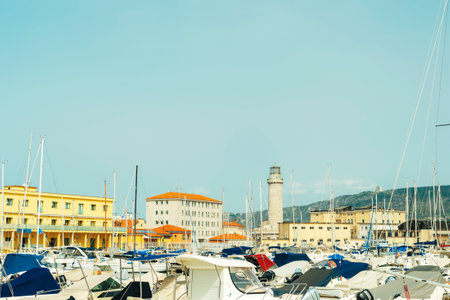 Trieste Italy - 30 march 2024: View of the pier and lighthouse against a blue sky.のeditorial素材