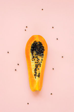 Papaya fruit on pink background. Food concept. Top view, flat layの写真素材