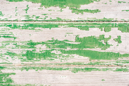 Old wooden surface with peeling green paint. Texture, backgroundの写真素材