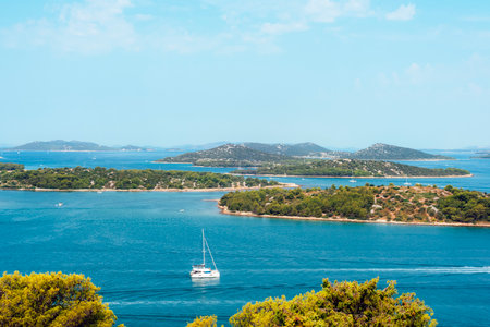 Tropical islands with turquoise sea and sailing boats on a sunny summer day. Summer travel concept. Murter, Croatiaの写真素材