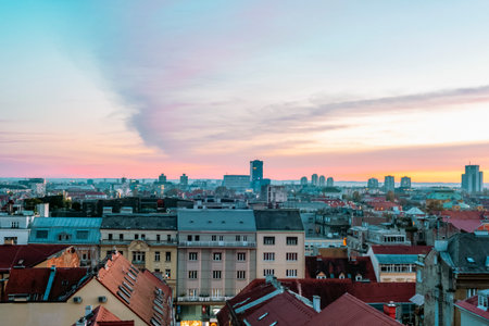 City skyline at sunset with colorful sky above rooftops. Zagreb, Croatiaの写真素材