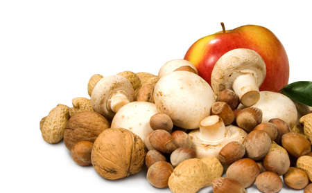 apple, nuts and mushrooms on a white backgroundの写真素材