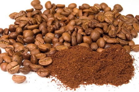 ground coffee and beans on a white backgroundの写真素材
