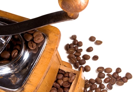 Wooden coffee mill with coffee beans on white backgroundの写真素材