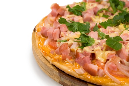 pizza with ham closeup on white backgroundの写真素材