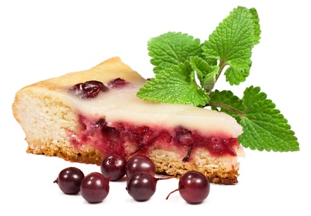 a piece of berry pie with mint leaves on a white backgroundの写真素材