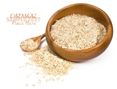 oatmeal in a wooden bowl on a white backgroundの写真素材
