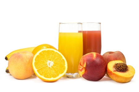 two glasses of juice and fresh fruits on white backgroundの写真素材