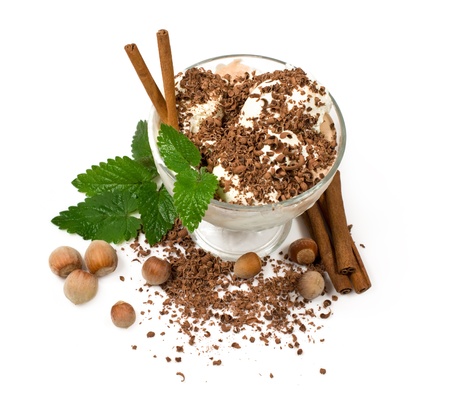 ice cream with chocolate, nuts and cinnamon over whiteの写真素材