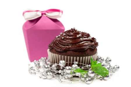 cake with chocolate cream and bonbonniere isolated on whiteの写真素材