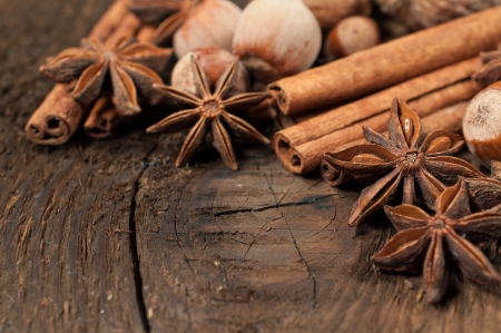 cinnamon sticks and star anise on the wooden textured の写真素材