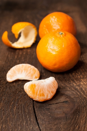 mandarins on a wooden background close upの写真素材