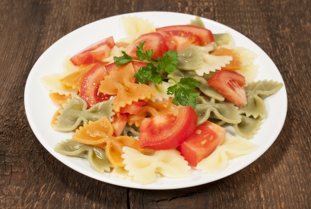 farfalle with tomatoes and olive oil の写真素材