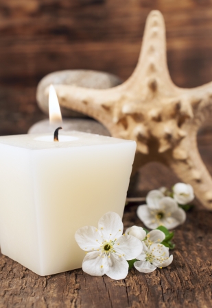 spa still life with aromatic candles, starfish , stones and cherry blossom

の写真素材