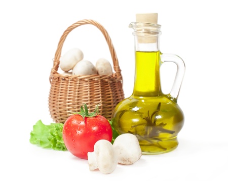 fresh vegetables and olive oil isolated on a whiteの写真素材
