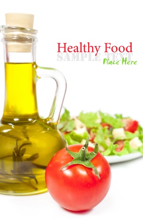 tomatoes , a bottle of olive oil and vegetable salad
の写真素材