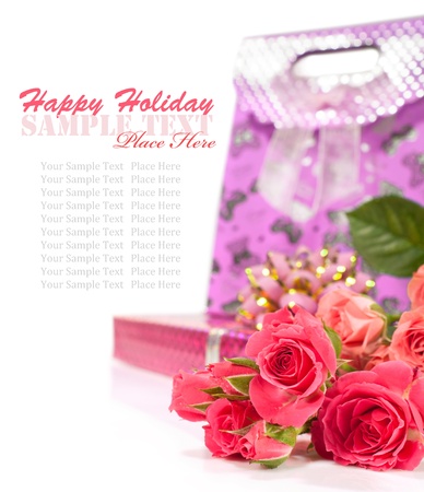 bouquet of roses and a gift box for the holiday isolated on whiteの写真素材