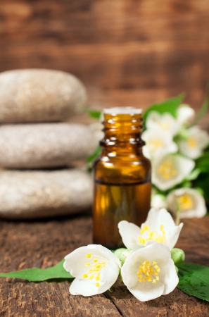 Jasmine essential oil for aromatherapy on a wooden backgroundの写真素材