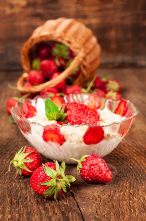 strawberry dessert with  mousse and fresh berries on the wooden backgroundの写真素材