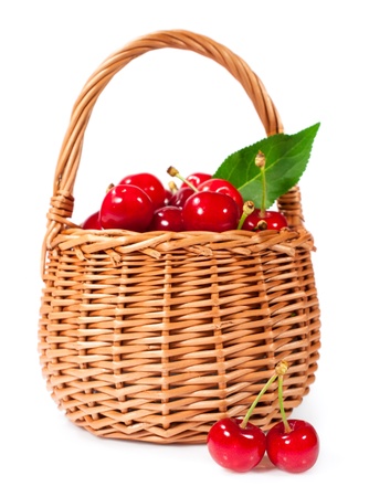 basket of ripe cherries isolated on whiteの写真素材