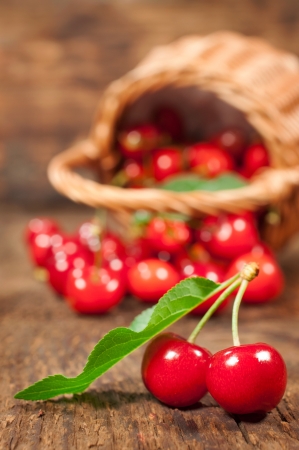 ripe cherry close-up on wooden backgroundの写真素材