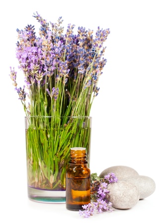 lavender flowers and essential oil isolated on whiteの写真素材