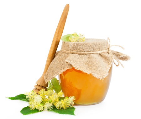 Sweet honey with linden blossoms isolated on whiteの写真素材