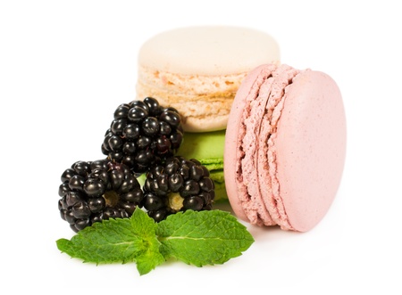 colorful macaroon with ripe blackberry isolated on a whiteの写真素材